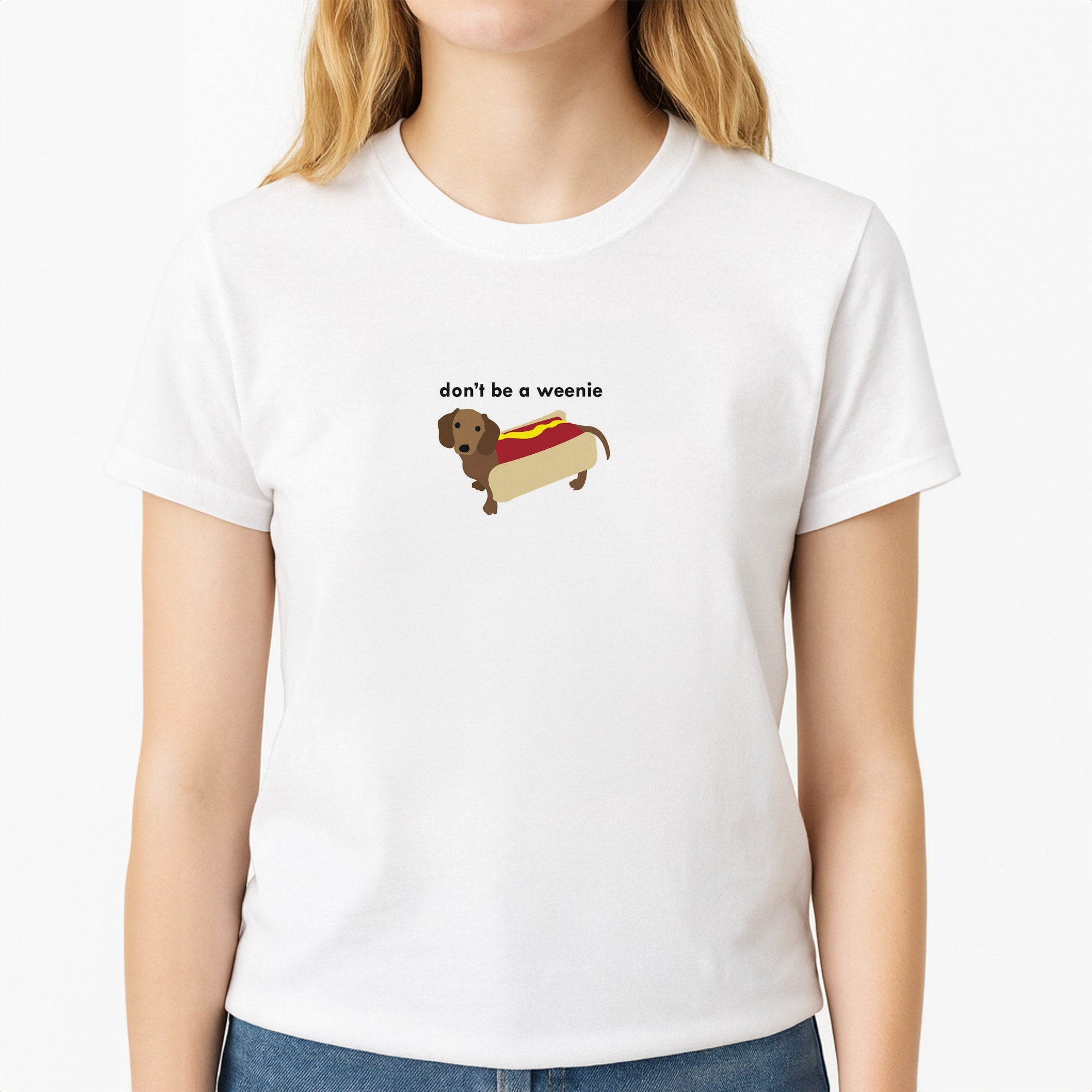 Don't Be A Weenie - Dachshund Unisex T-Shirt, worn by a female model