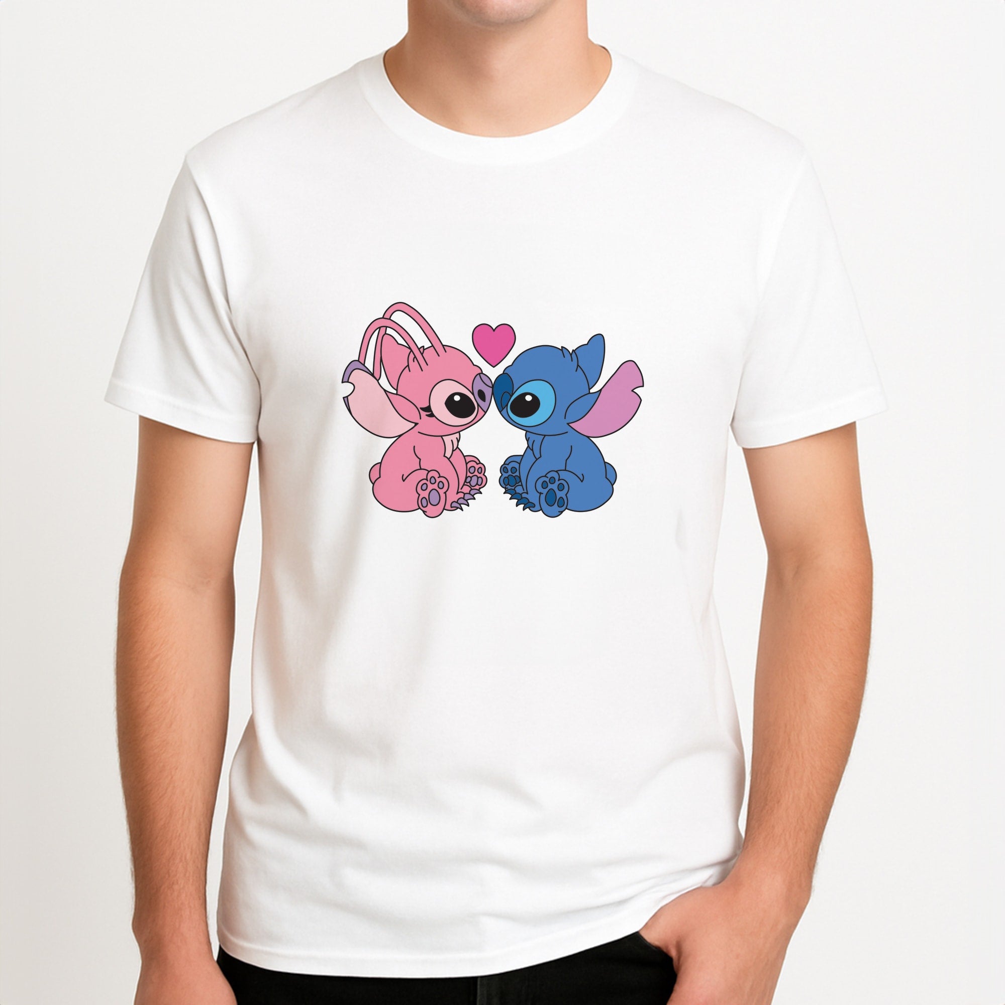 Angel And Blue Alien - Pink Alien Unisex T-Shirt, worn by a male model.