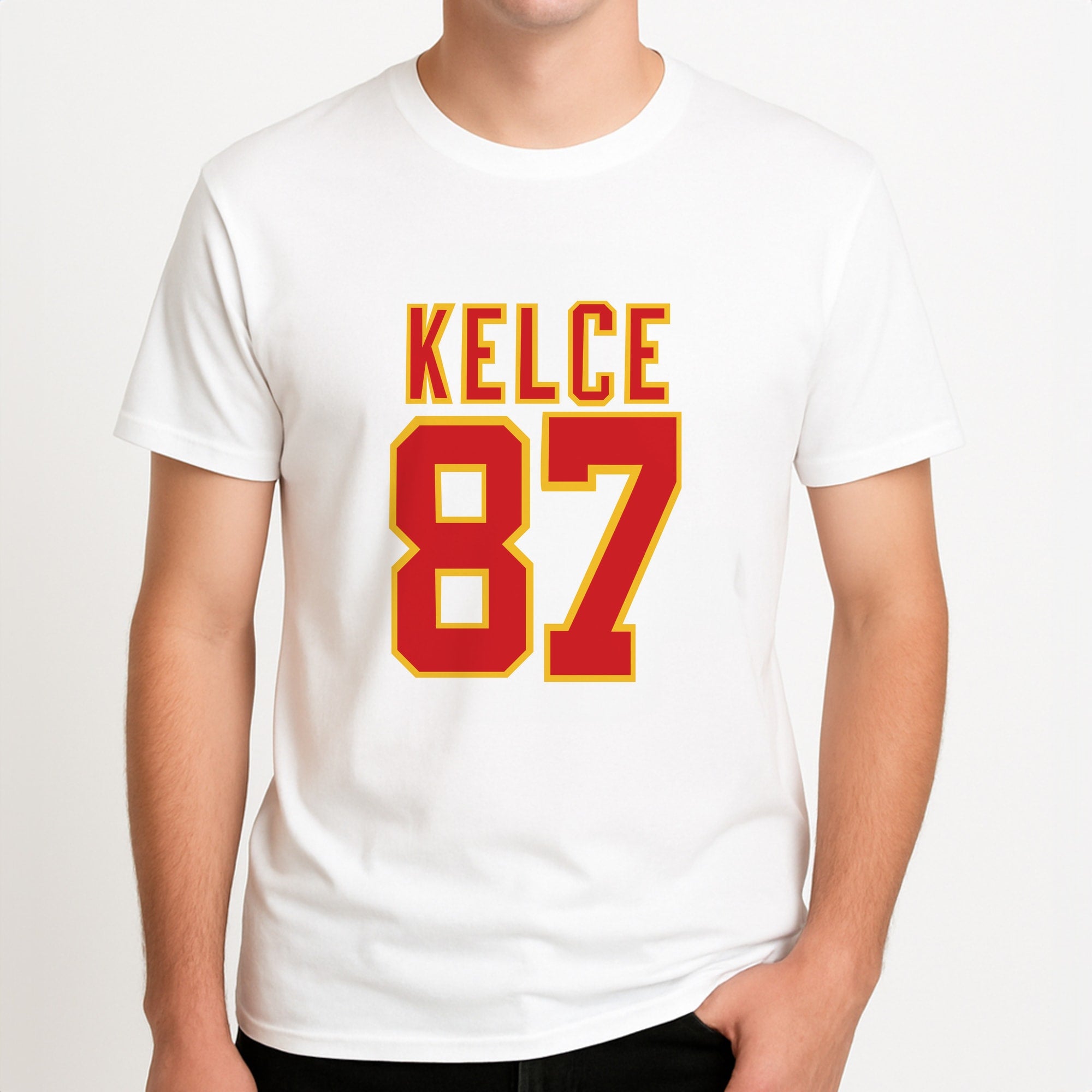 Kelce 87 - Travis Unisex T-Shirt, worn by a male model.