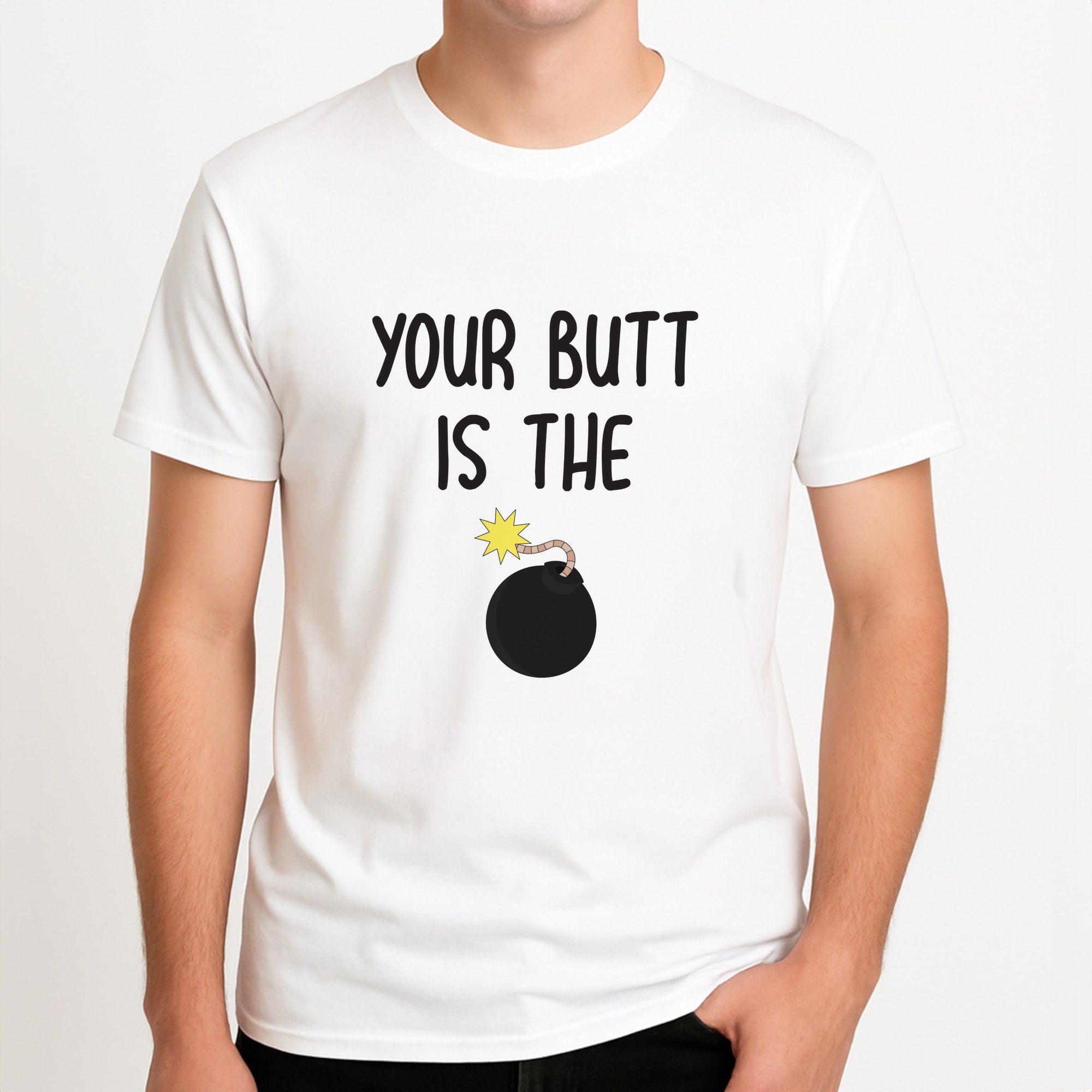 Your Butt Is The Bomb - B99 Unisex T-Shirt, worn by a male model.