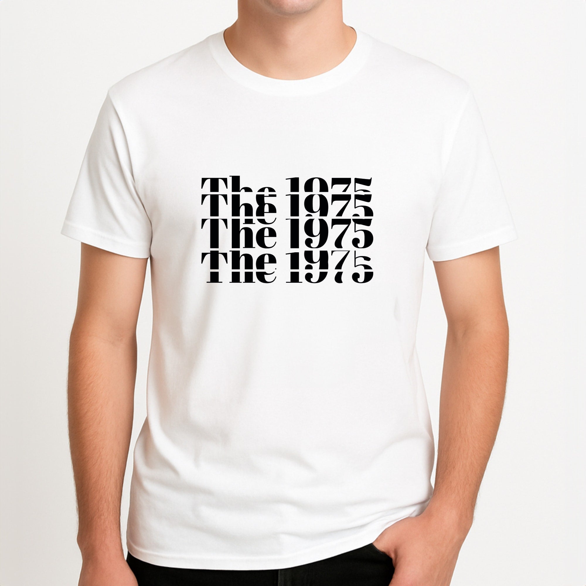 Title - The 1975 Unisex T-Shirt, worn by a male model.
