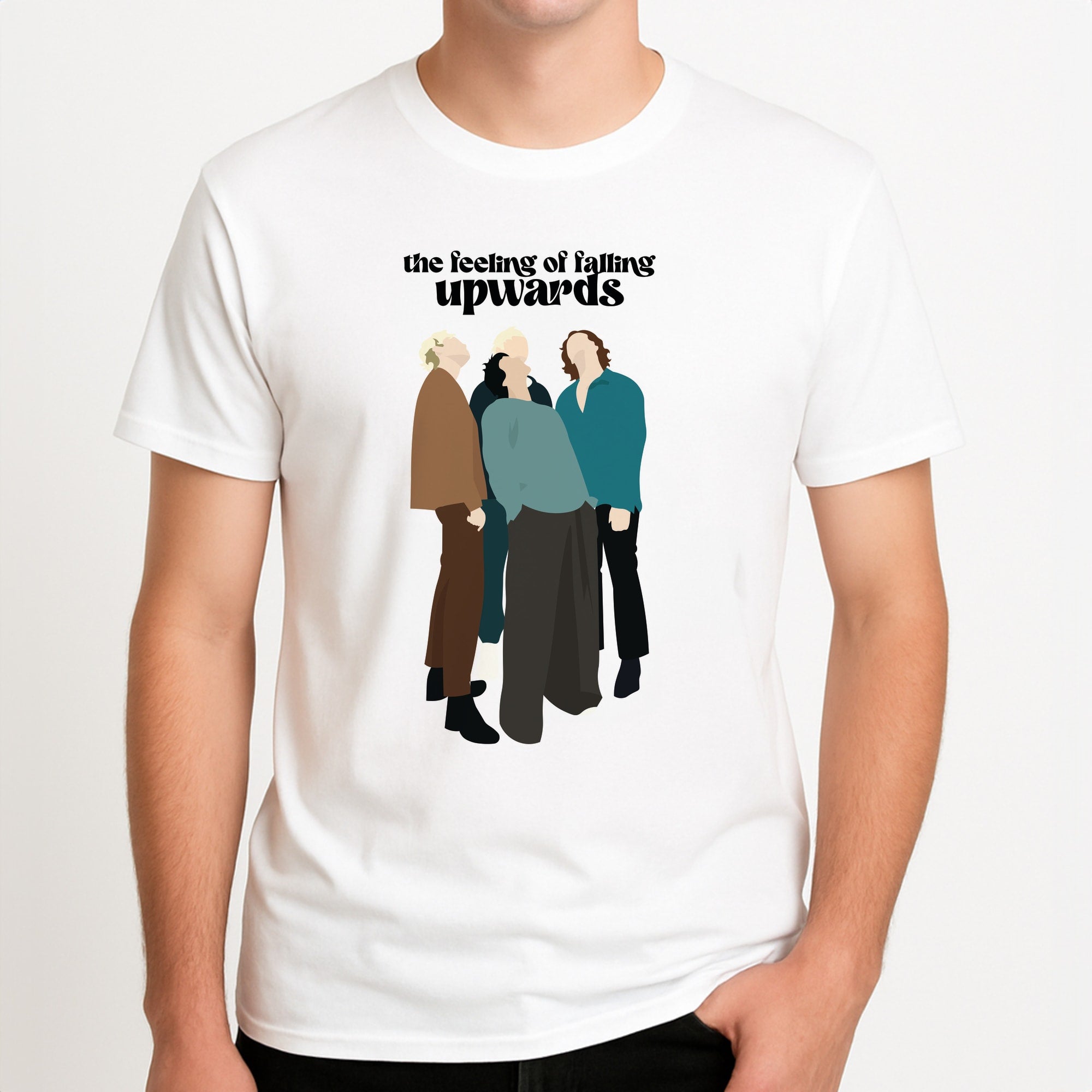 The Feeling Of Falling Upwards Unisex T-Shirt, worn by a male model.