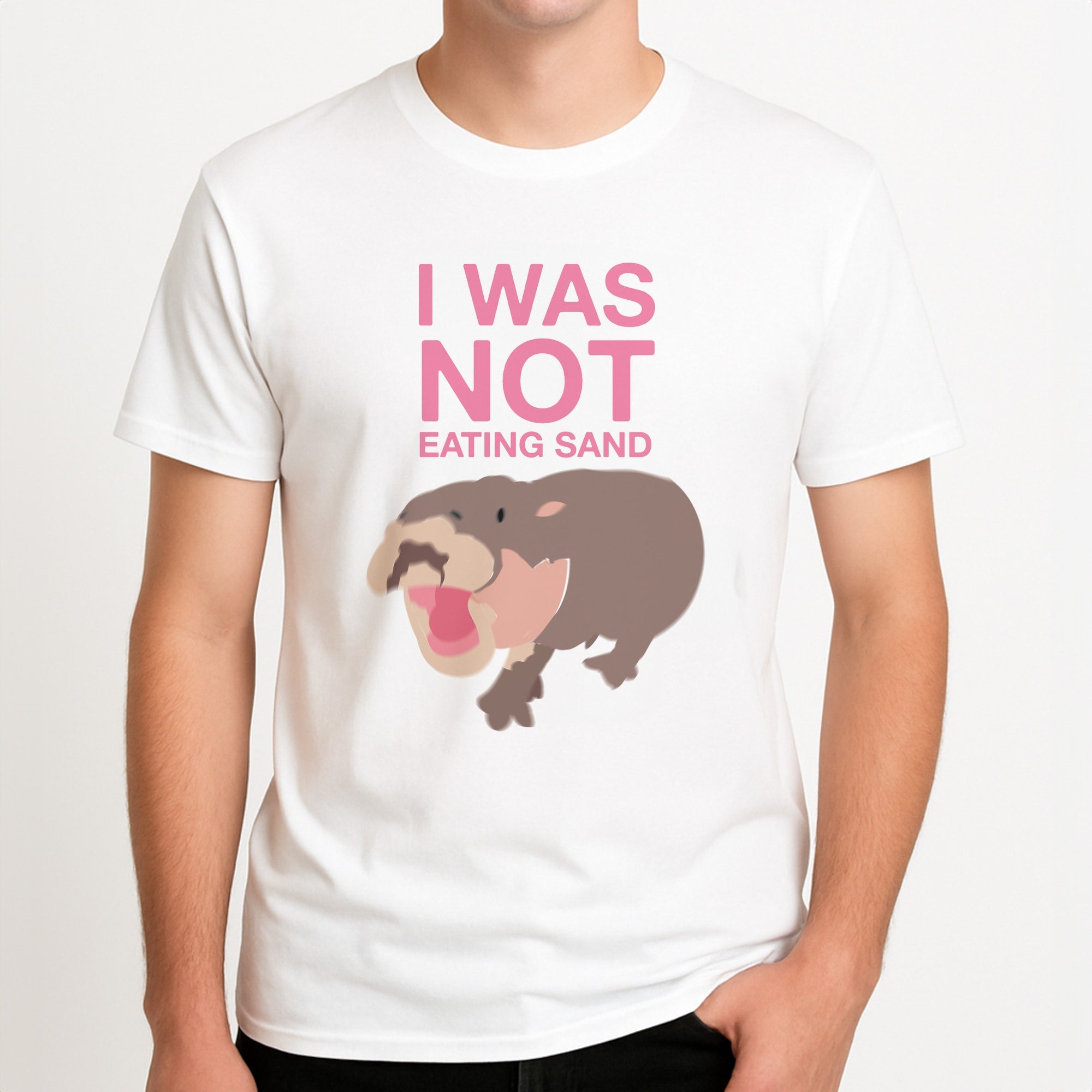 I Was Not Eating Sand Unisex T-Shirt, worn by a male model.