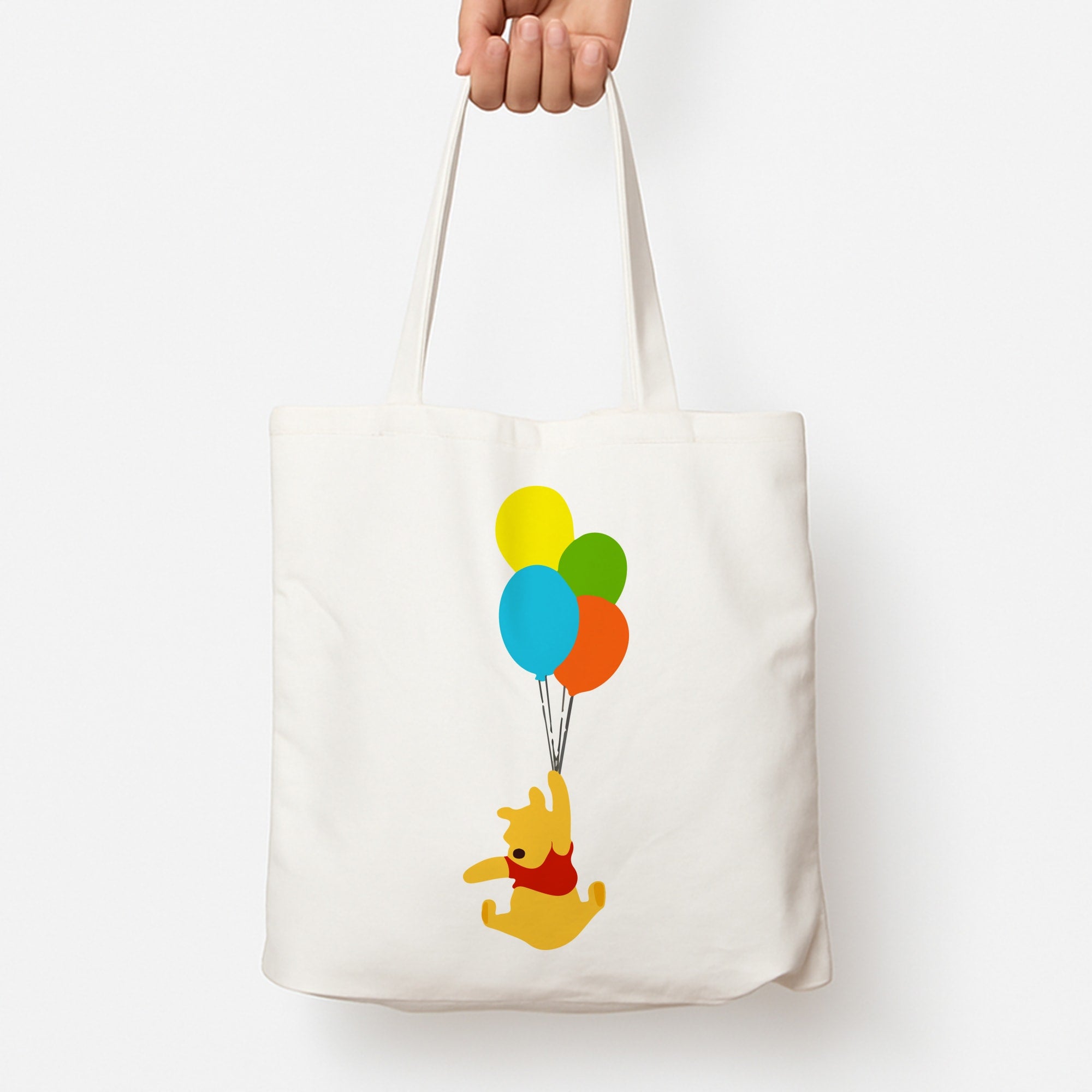 Pooh On Balloons Tote Bag