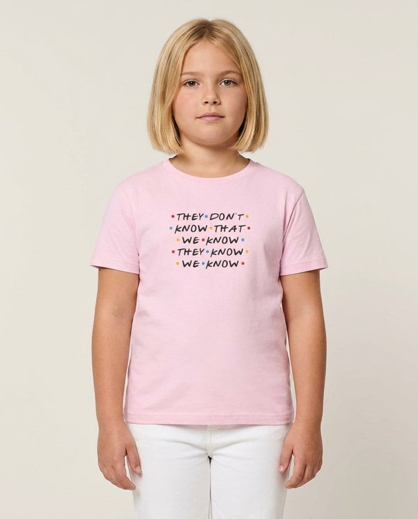 They Dont Know That We Know Kids T-Shirt — Pink Front, worn