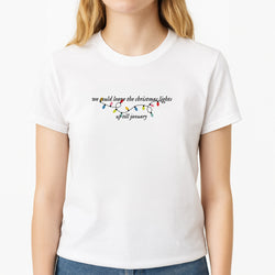 We Can Leave The Christmas Lights Up Til January - Christmas Songs Unisex T-Shirt, worn by a female model