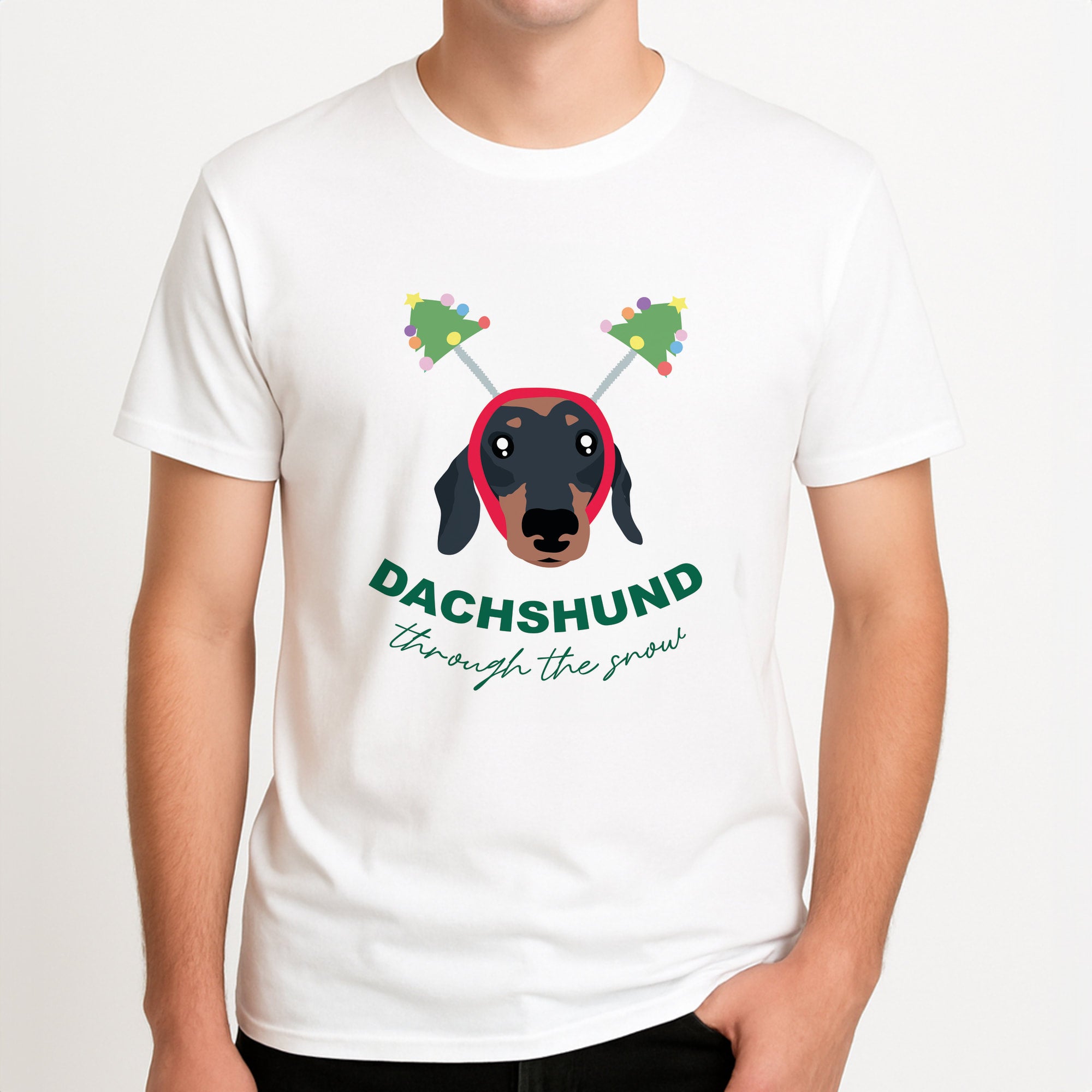 Dachshund Through The Snow Unisex T-Shirt, worn by a male model.