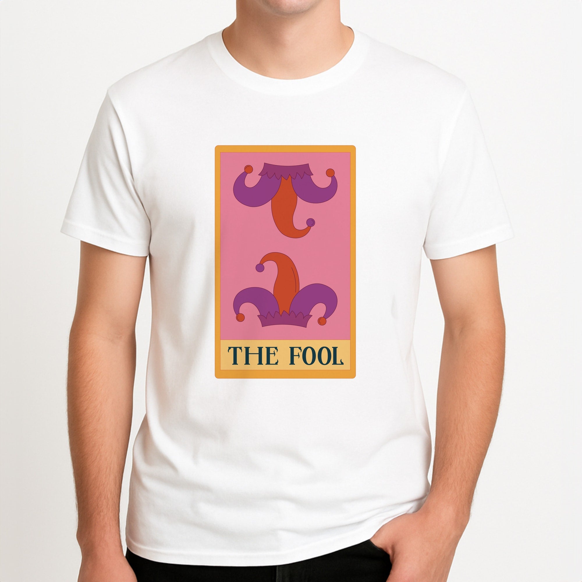 The Fool - Tarot Cards Unisex T-Shirt, worn by a male model.