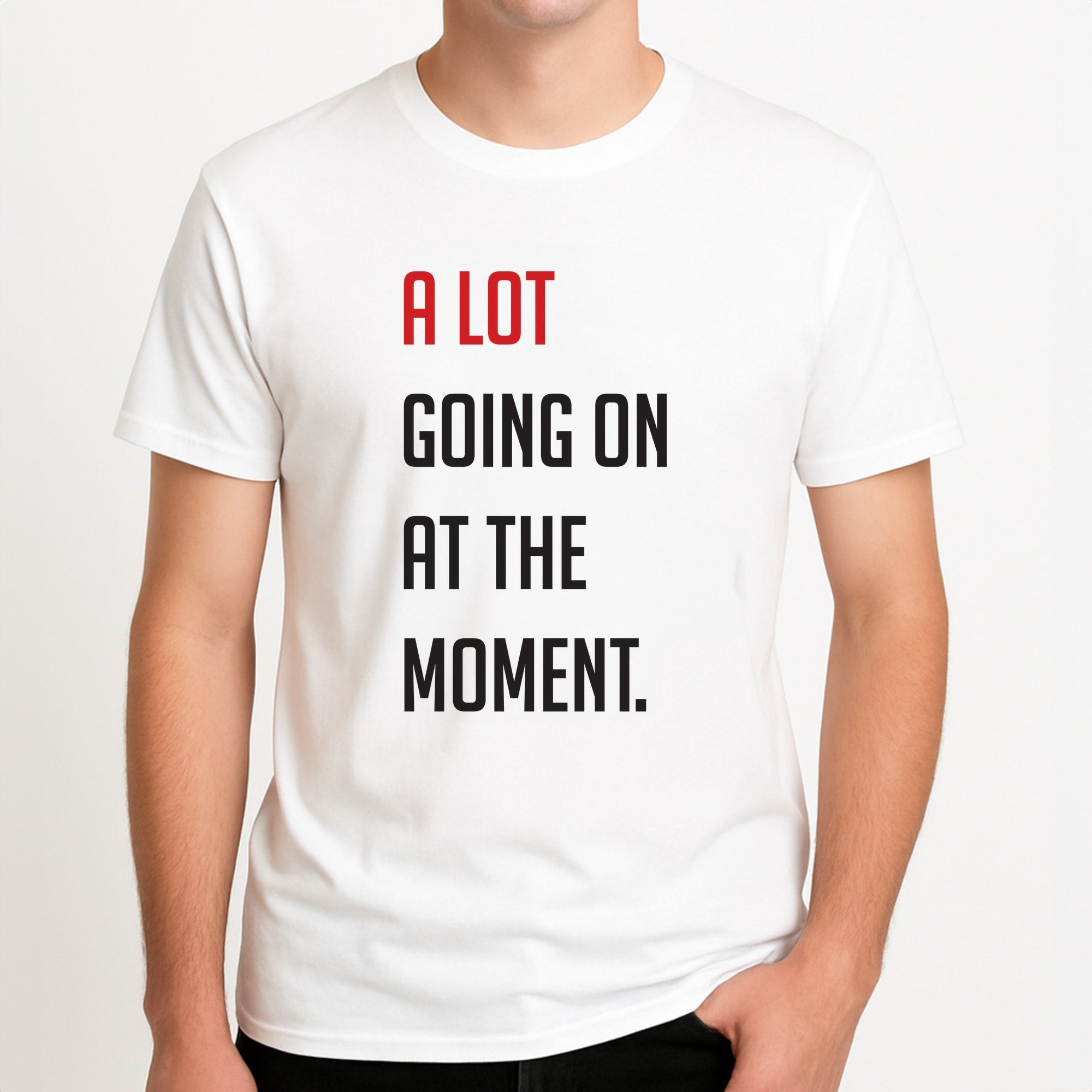 A Lot Going On At The Moment - Taylor Unisex T-Shirt, worn by a male model.