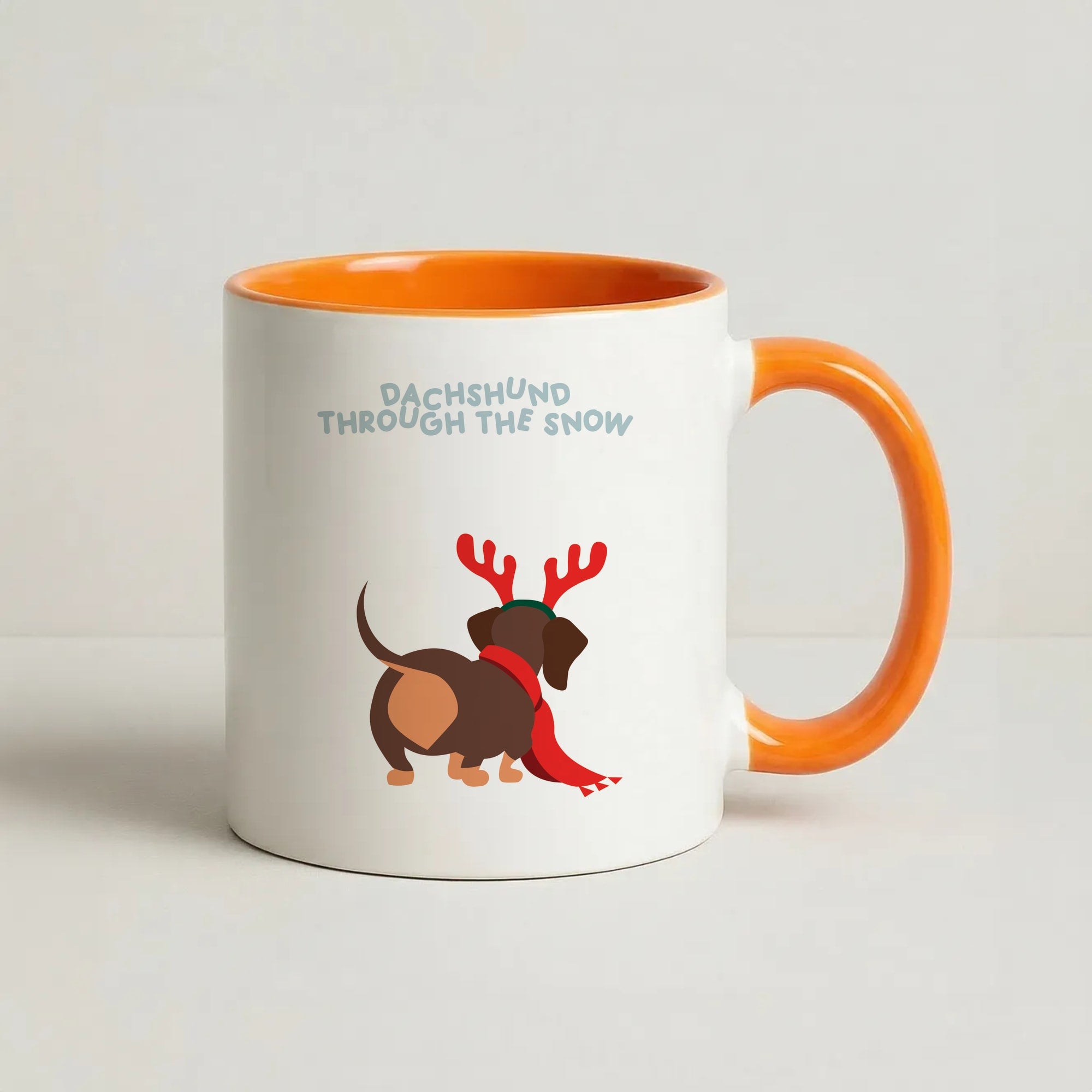 Dachshund Through The Snow - Christmas Coffee Orange Mug