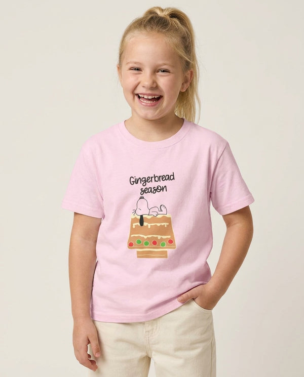 Cartoon Beagle Gingerbread House Kids T-Shirt — Pink Front, worn