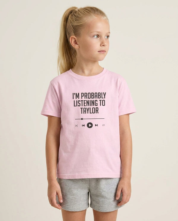 I'm Probably Listening To Taylor Kids T-Shirt — Pink Front, worn